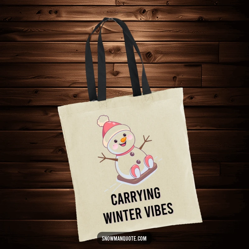 Funny Tote Bag: A cheerful snowman wearing a hat askew slides happily down a snow-covered hill, showcasing winter's delight.
